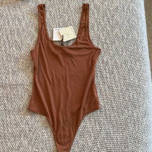 Ribbed style bodysuit (thong-like) NEVER been worn